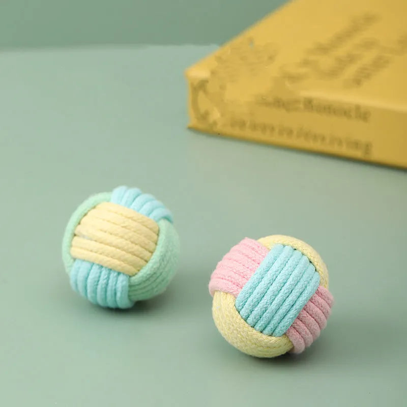 Handmade plush cotton cat hair ball toy in mixed colours, shown next to a ruler indicating 5cm size.