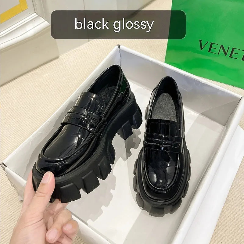British style wide fit loafers in patent or matte leather with a rubber sole.