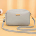 Women's solid colour PU shoulder bag in a horizontal square shape with a three-dimensional pocket.