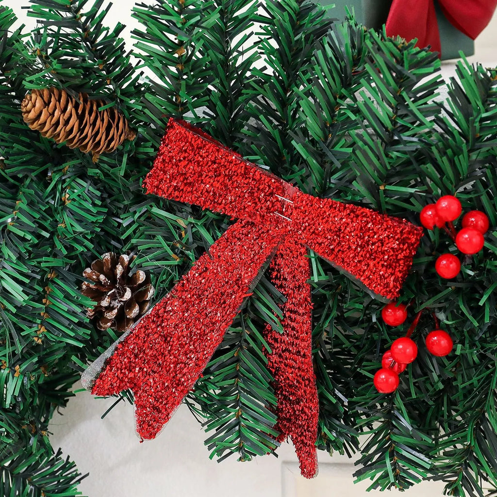 Christmas rattan pine cone bow decorative centrepiece with LED lighting on wooden table