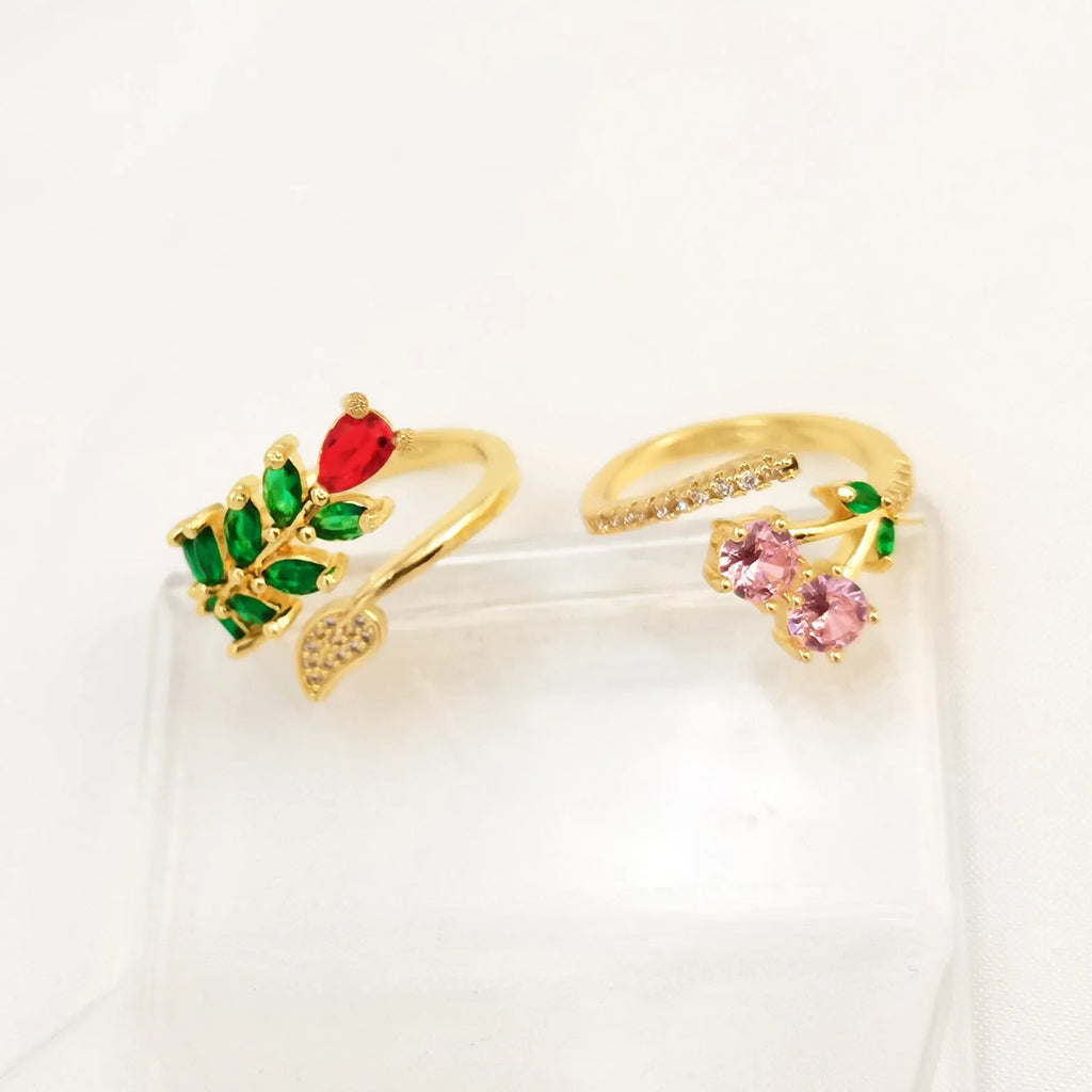Women's geometric open ring with gold-plated copper construction, leaf design, and zircon crystal accents