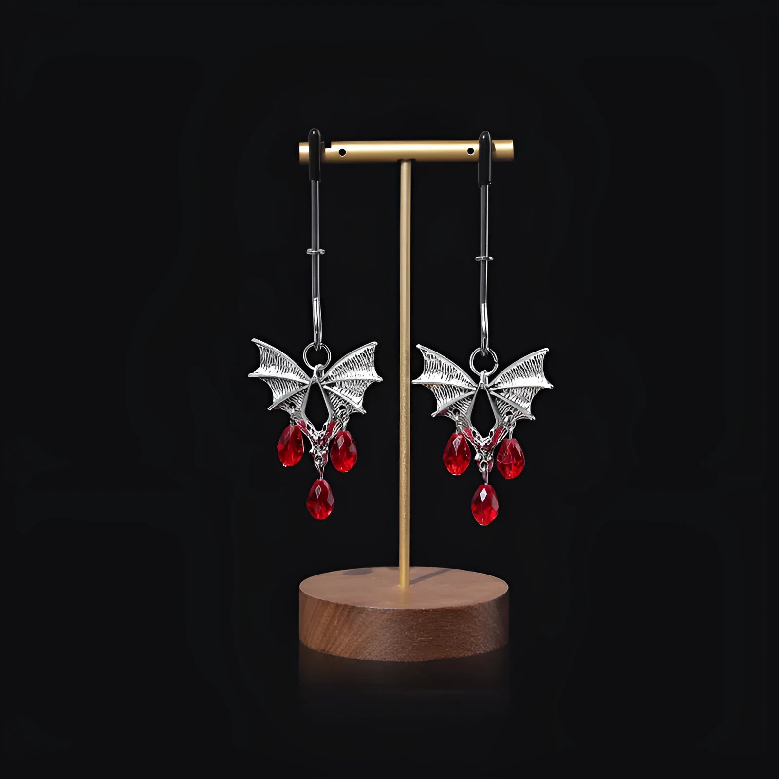 Silver alloy adjustable bat nipple clamp with ruby decorative clip for adult use.
