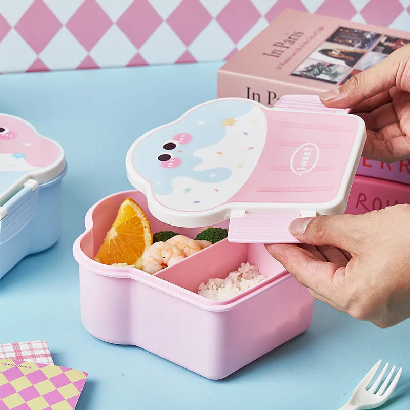 Pink and blue creative ice cream shaped plastic lunch box with compartments, shown with matching spoon and fork.
