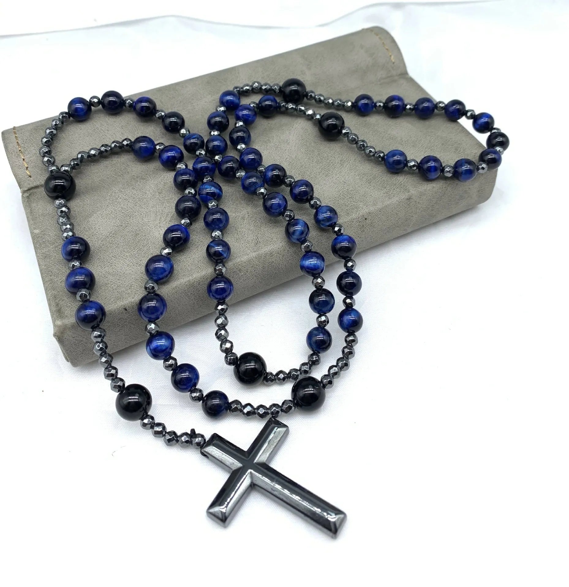 Men's stone cross pendant necklace with hand-woven detail on an 80cm ball bead chain.