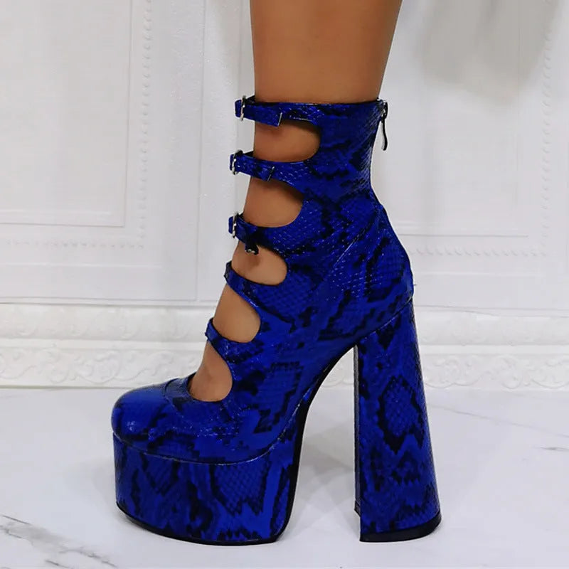 Women's black patent leather platform high heel boots with a thick heel and serpentine ankle buckle.