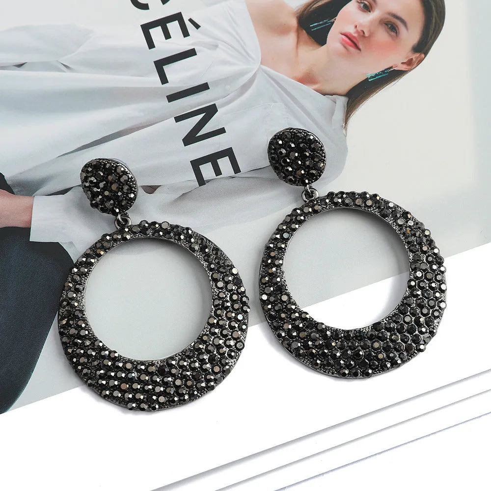 Colourful metal round pendant earrings with diamond design in cartoon style