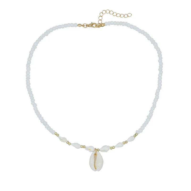 White conch shell pendant and bead necklace on a regular chain.