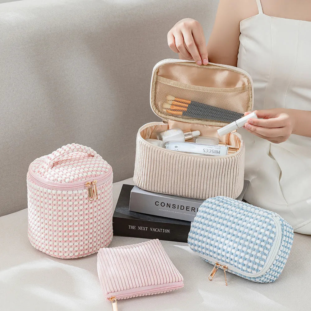 Four cube-style flannelette makeup bags in a set, shown in blue with dots colour option.