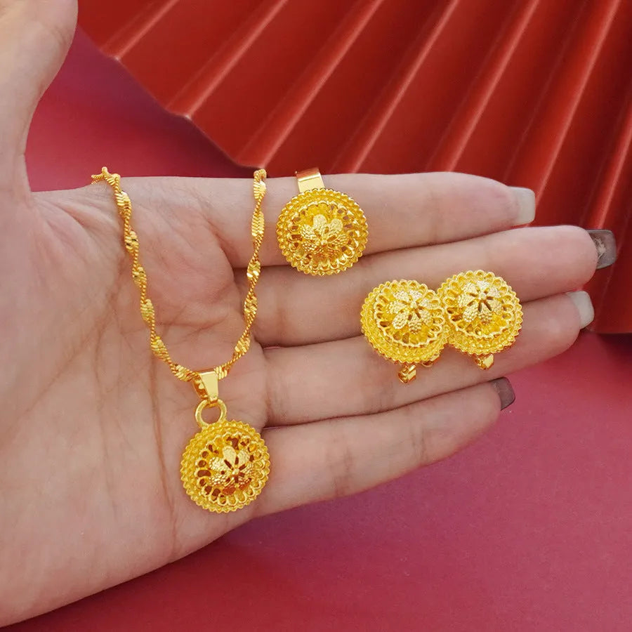Three-piece gold-plated floral jewellery suit with necklace, earrings and ring on water wave chain