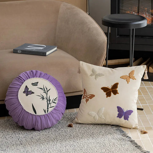 Square beige cushion with embroidered black butterfly in Chinese style pattern