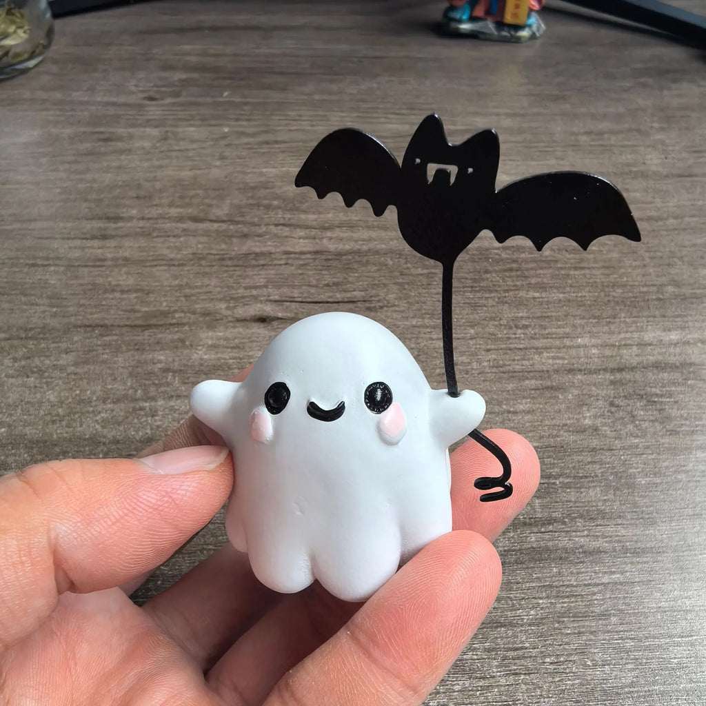 Mini ghost walking dog Halloween statue in resin, ghost holding bat design.