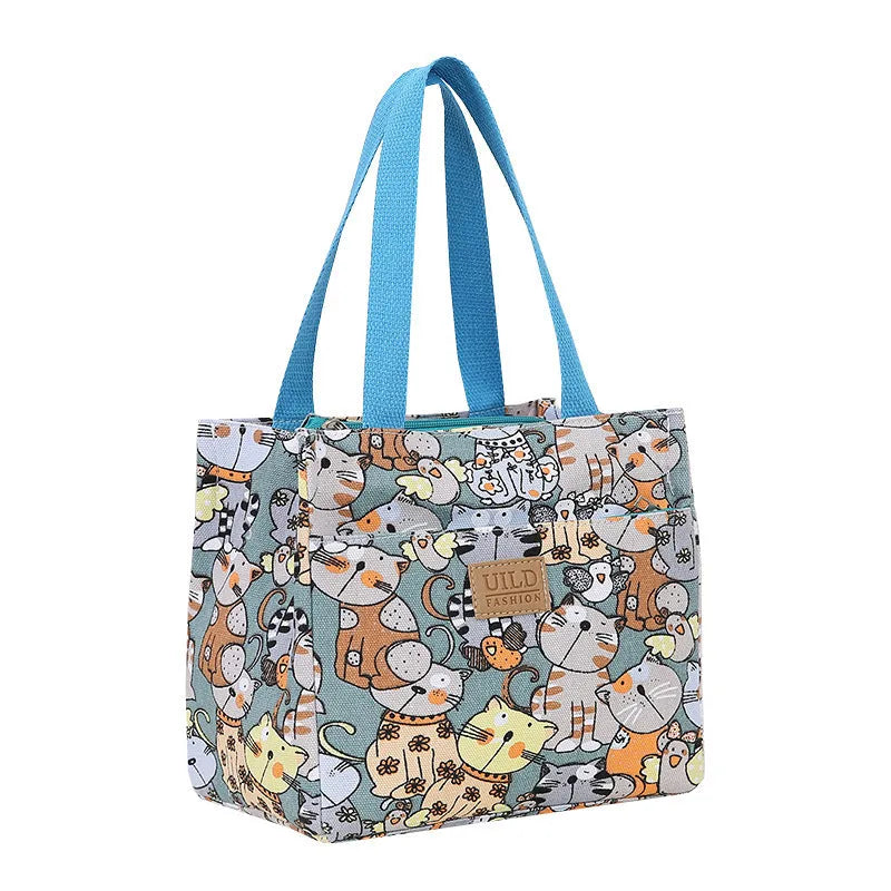 Women's printed canvas handbag with aluminium frame in square horizontal design showing floral pattern