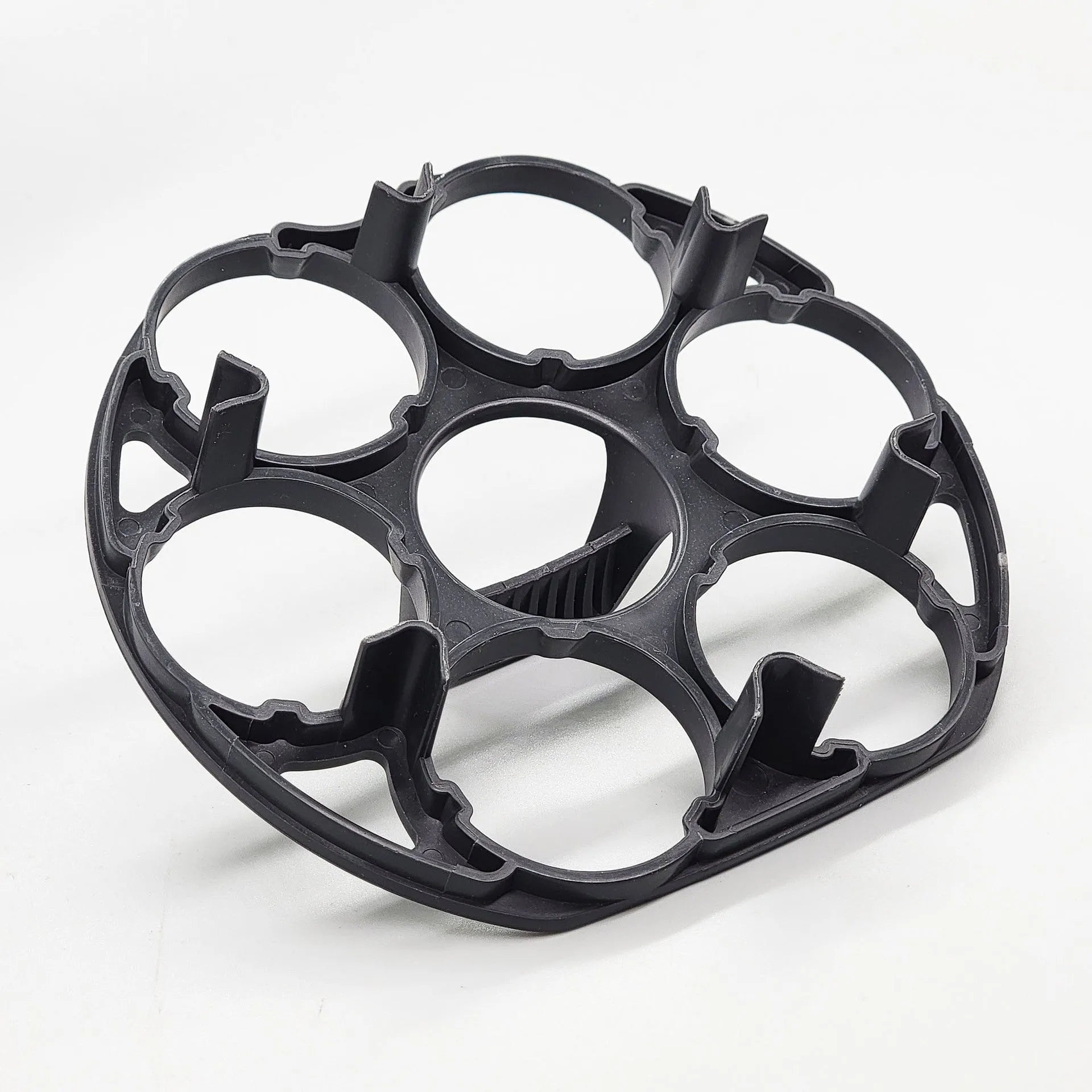 Black plastic egg holder basket with dimensions 13.8 by 12.6 cm.