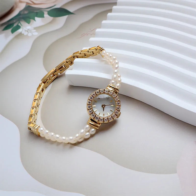 Women's light gold watch with freshwater pearl bracelet and 18mm round dial