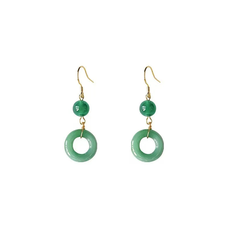 A pair of green geometric peace buckle earrings with a Chinese jade design, made from zinc alloy.