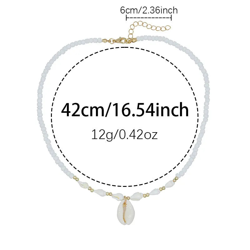 White conch shell pendant and bead necklace on a regular chain.