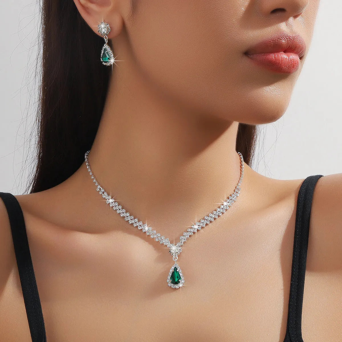 Women's claw chain necklace and earrings set with water drop rhinestones in multiple colour options