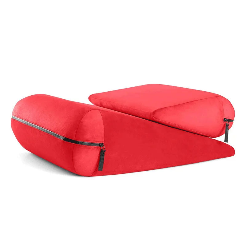 Embroidered triangle cushion in a choice of colours, shown on a sofa corner.