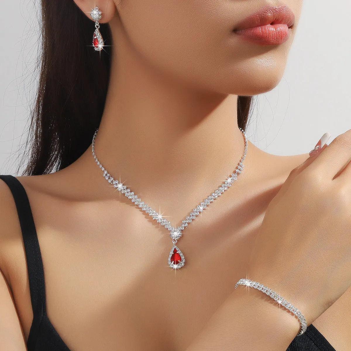 Women's claw chain necklace and earrings set with water drop rhinestones in multiple colour options