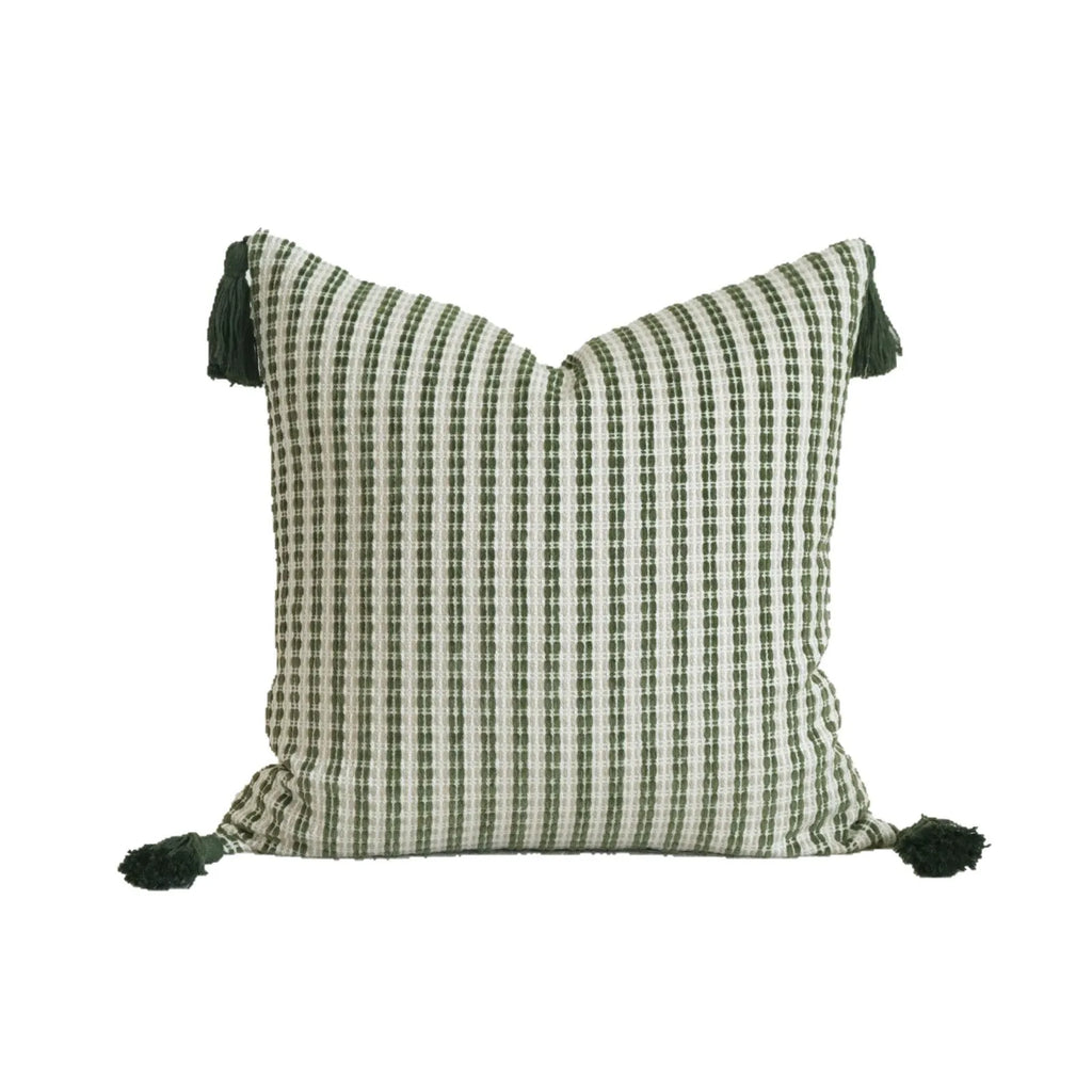 Green cotton and linen hotel sample pillow with tassel details and botanical patterns for display use