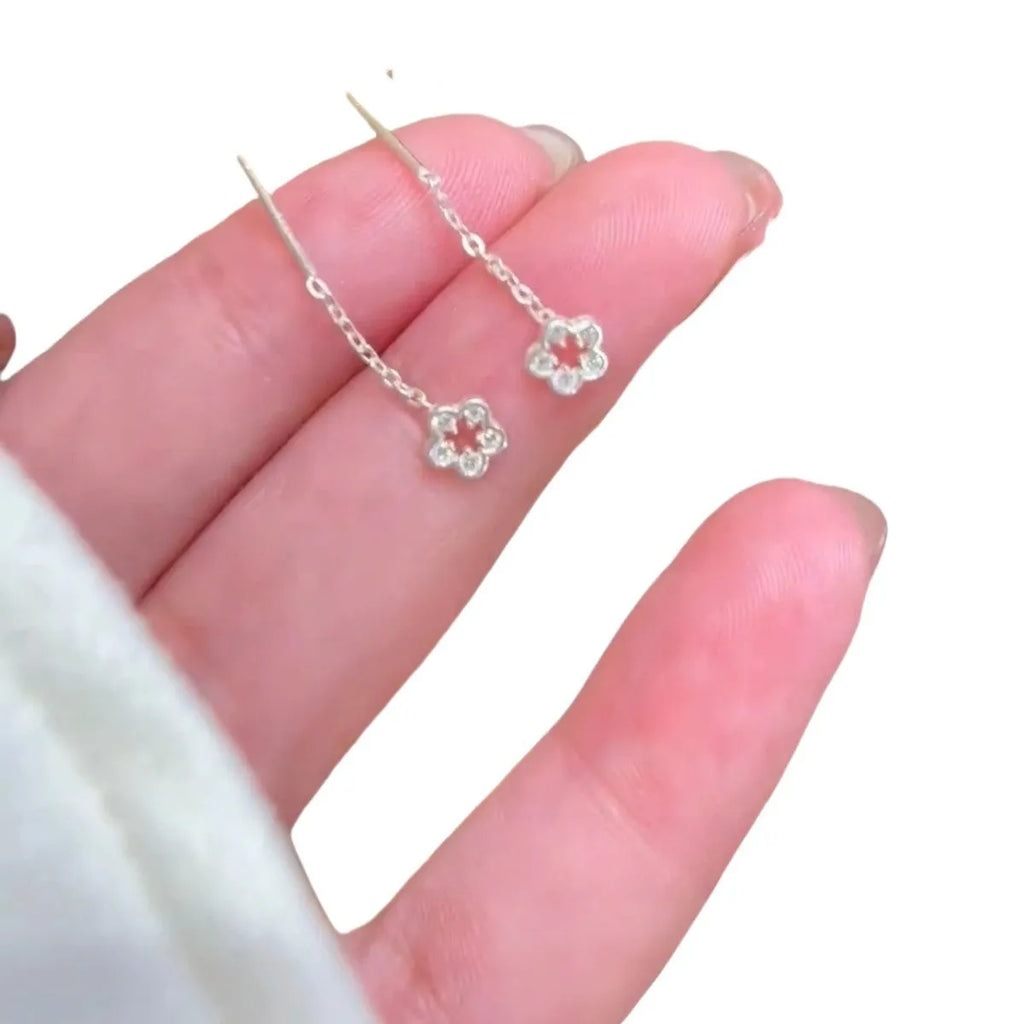 Silver colour hollow flower hanging earrings with natural petal design