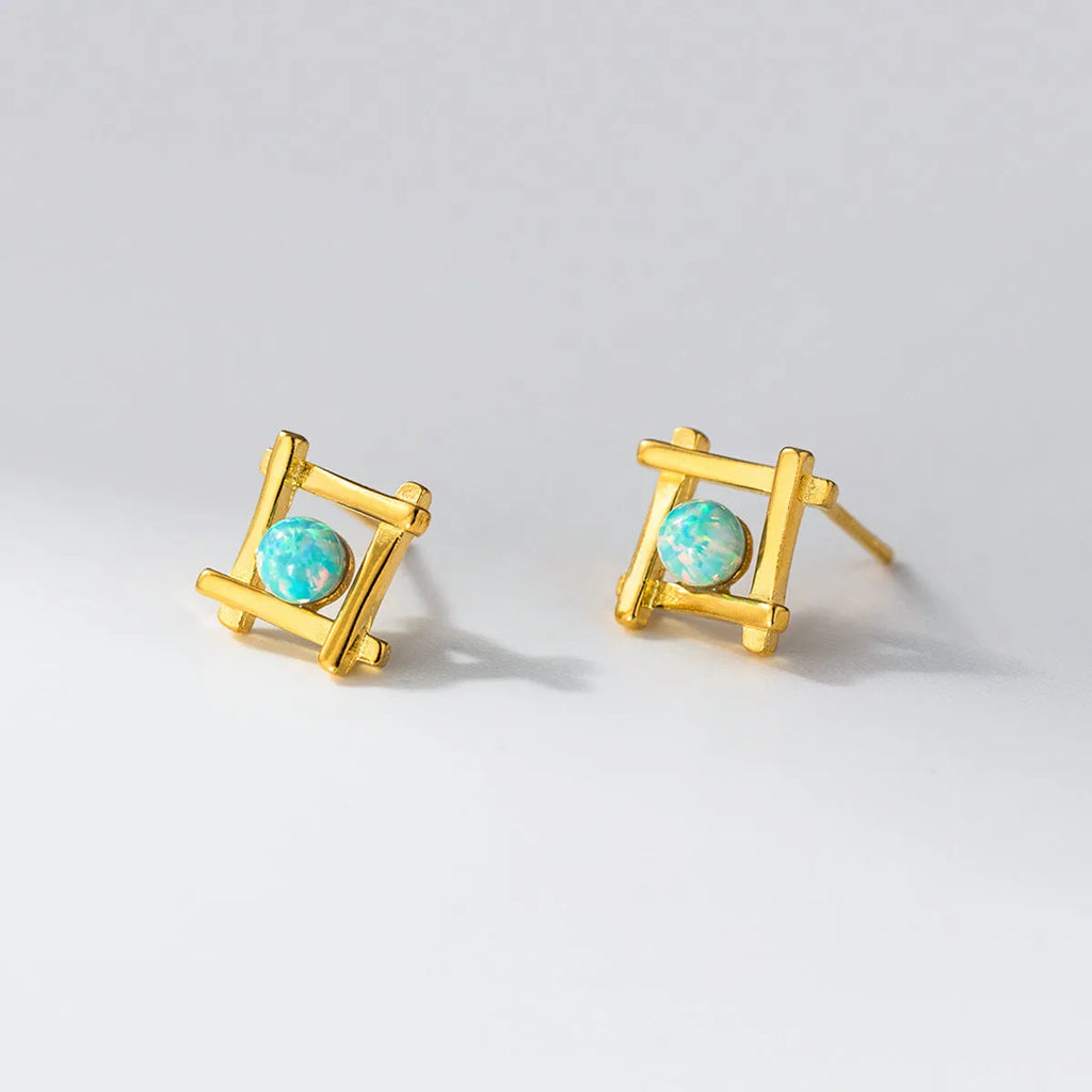 Women's geometric cross quadrangle stud earrings in sterling silver with gold or silver finish.