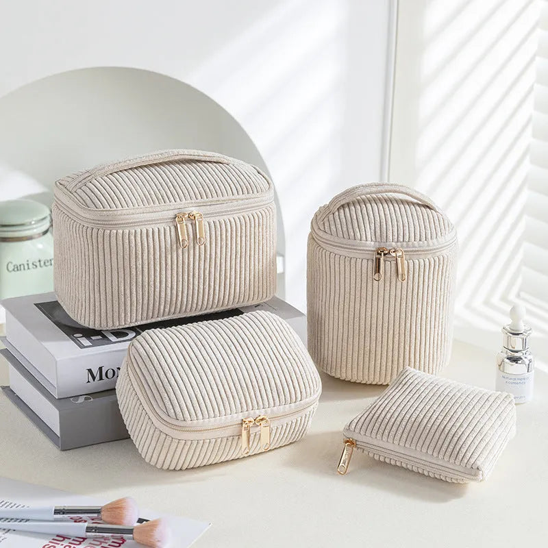 Four cube-style flannelette makeup bags in a set, shown in blue with dots colour option.