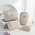 Four cube-style flannelette makeup bags in a set, shown in blue with dots colour option.