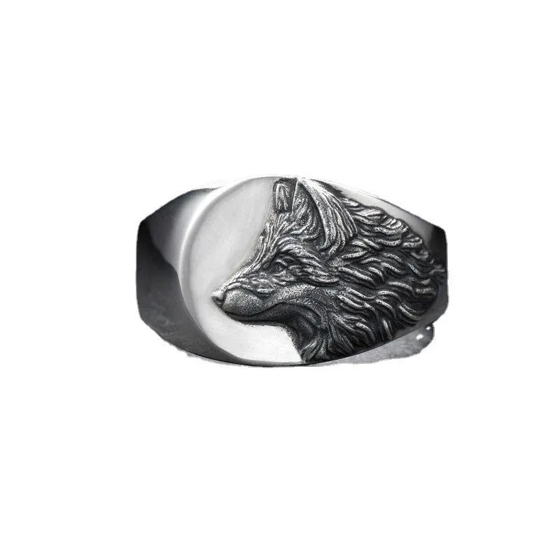 Silver geometric wolf ring for men on a grey background, showing angular retro design.