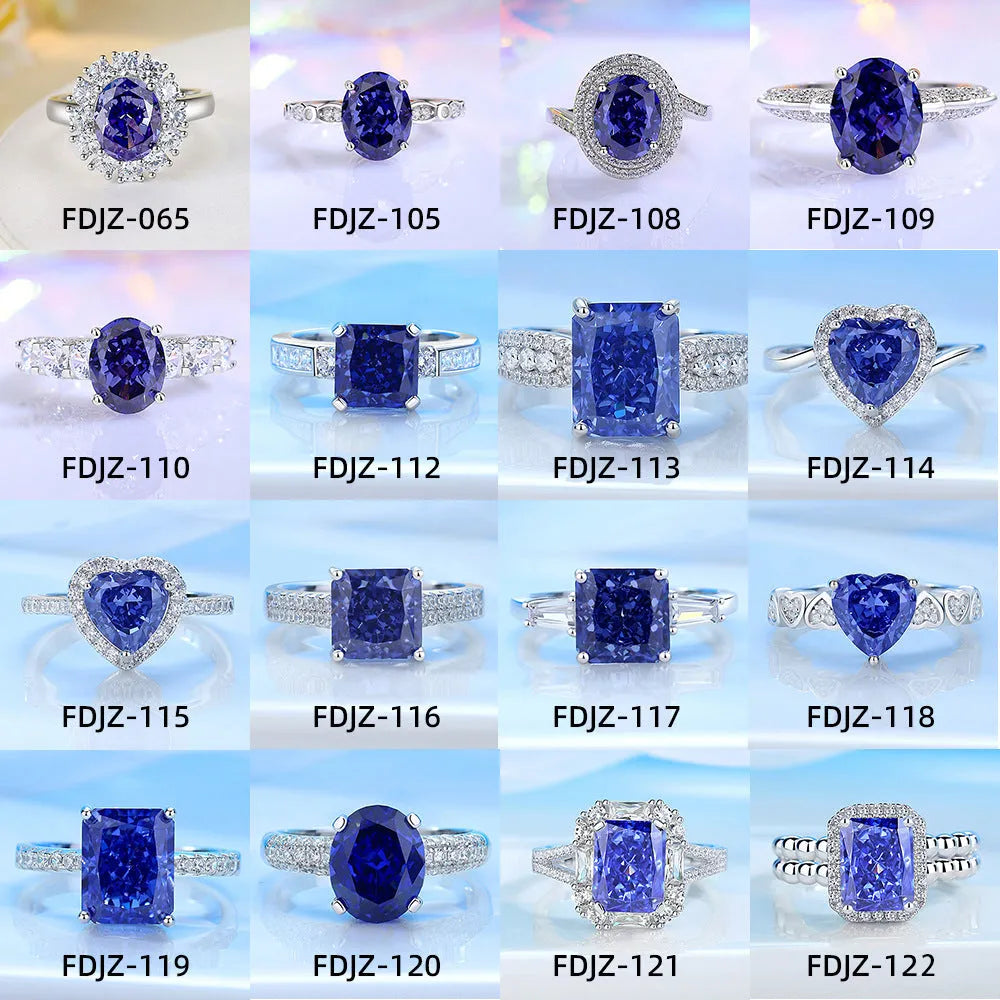 Heart shaped Tanzanite purple zircon ring in sterling silver on a grey background.