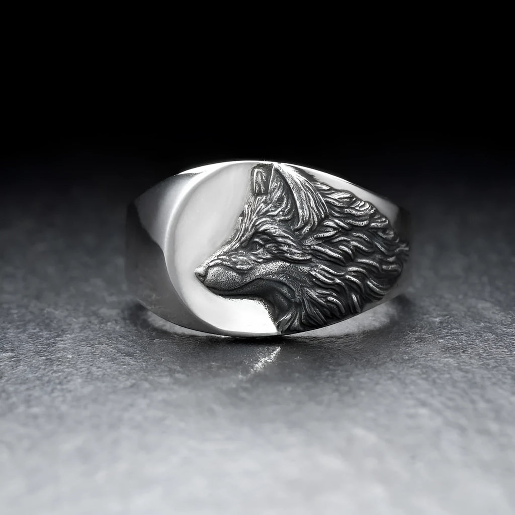 Silver geometric wolf ring for men on a grey background, showing angular retro design.
