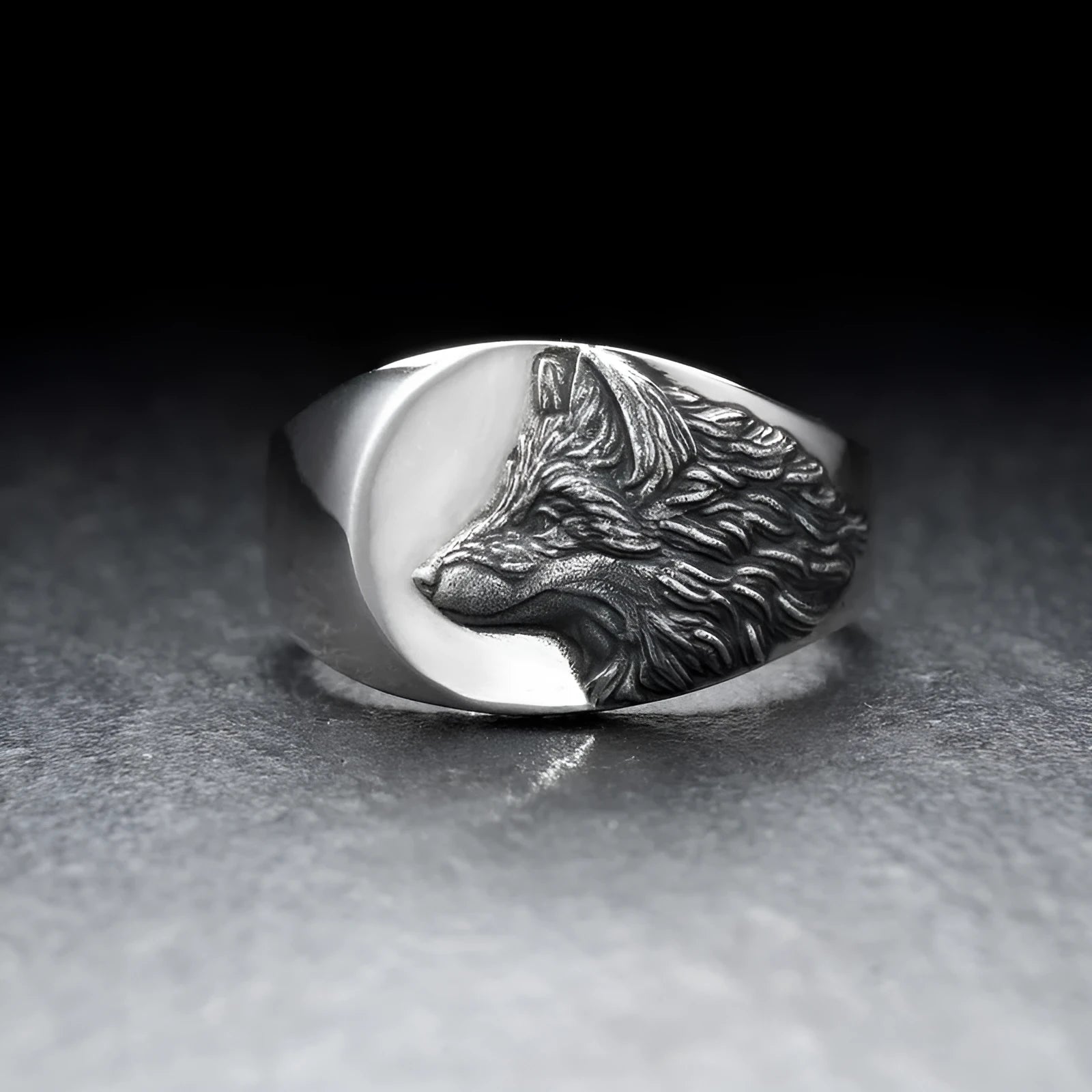 Silver geometric wolf ring for men on a grey background, showing angular retro design.