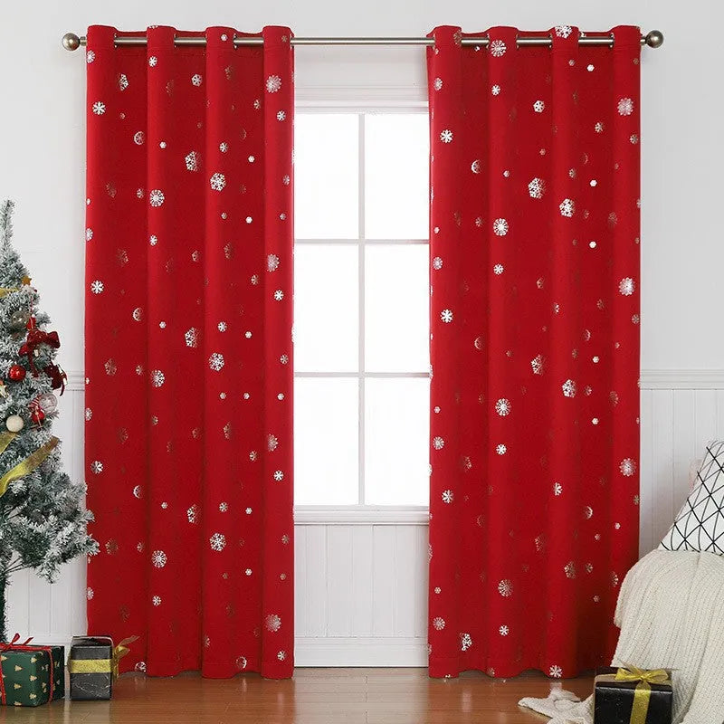 Red polyester snowflake pattern shade cloth curtain with lace loop trim hanging on a window