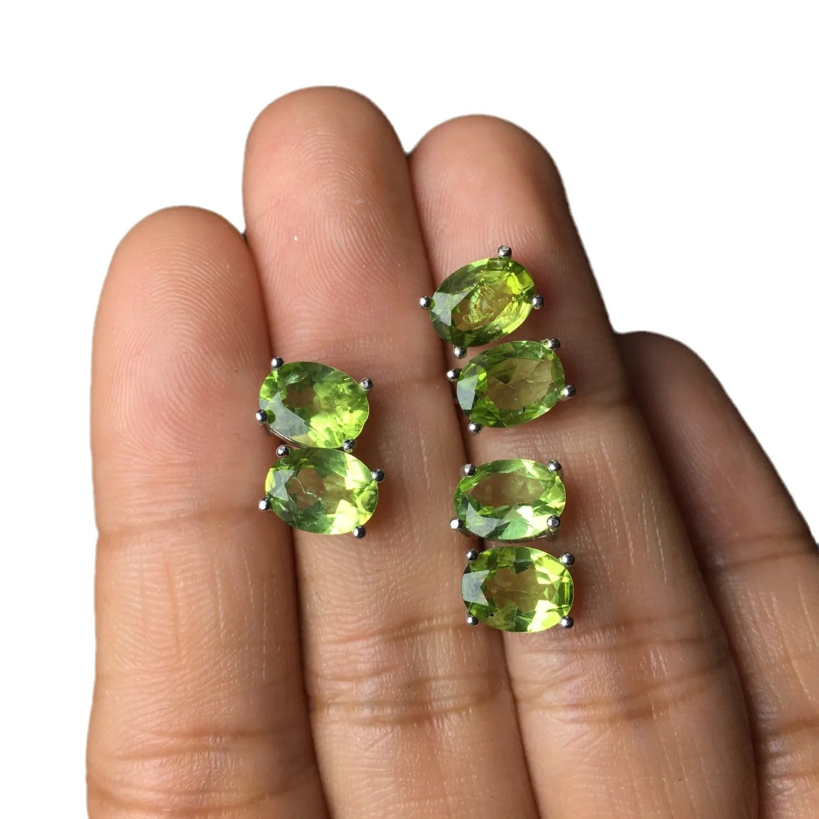 Natural olivine stud earrings with grass green oval stones in sterling silver setting