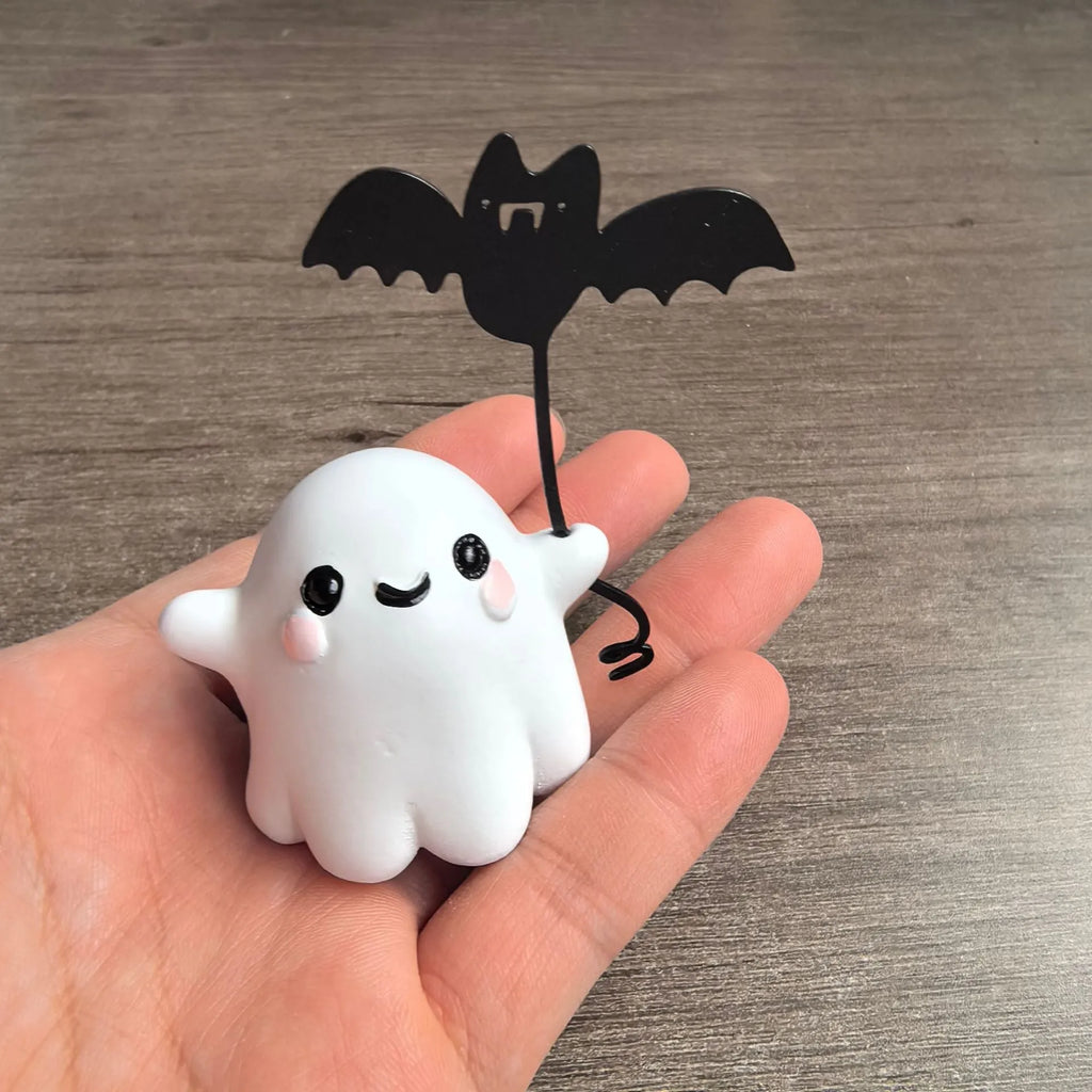 Mini ghost walking dog Halloween statue in resin, ghost holding bat design.