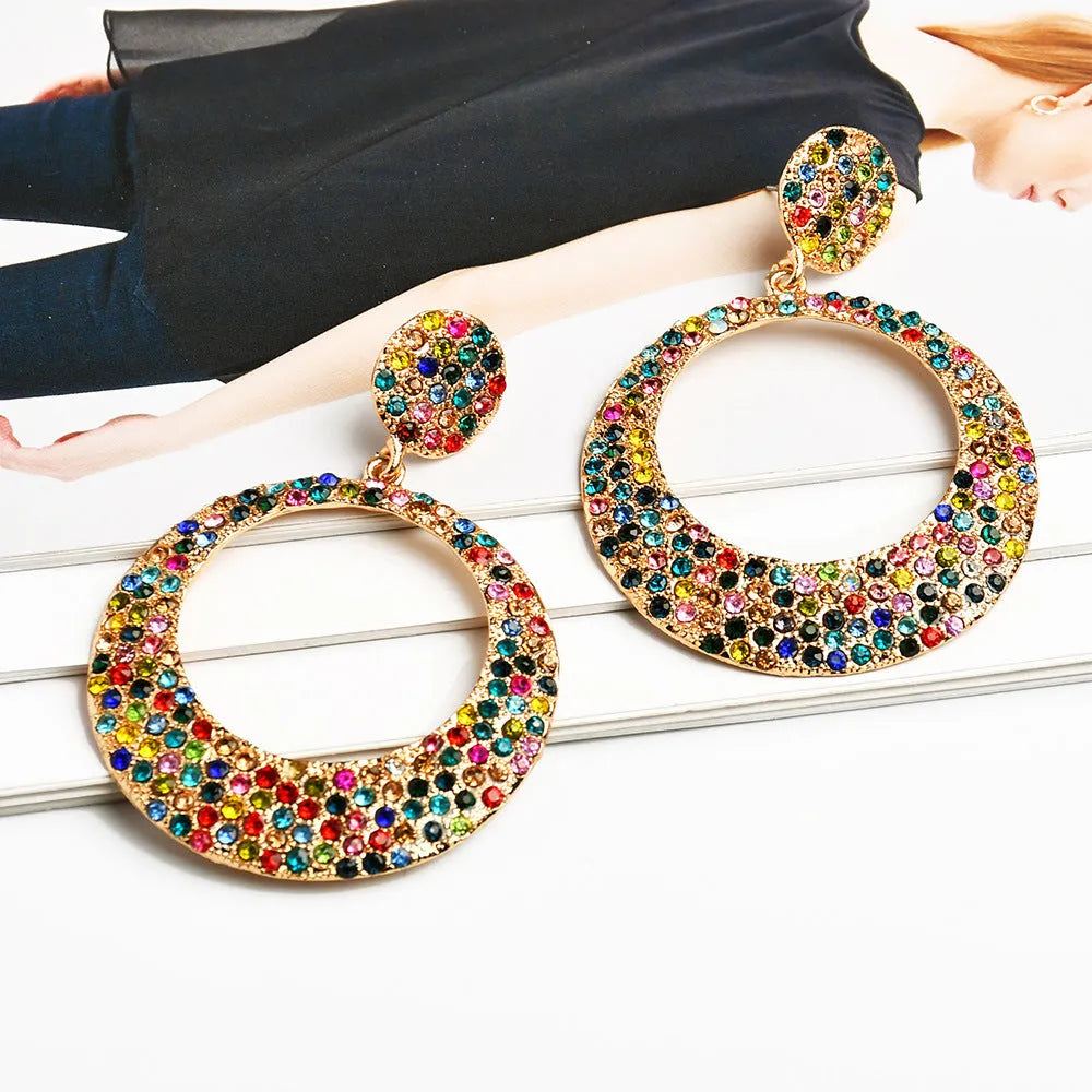 Colourful metal round pendant earrings with diamond design in cartoon style