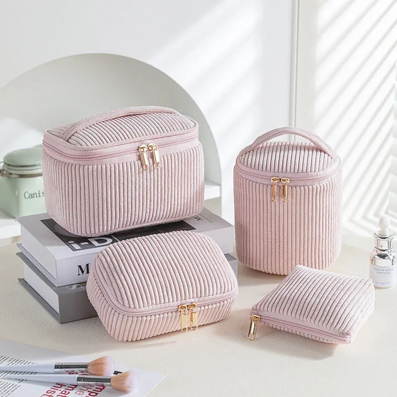 Four cube-style flannelette makeup bags in a set, shown in blue with dots colour option.