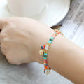 Handcrafted women's bracelet with imitation pearl beads in European style, showing colour variations.