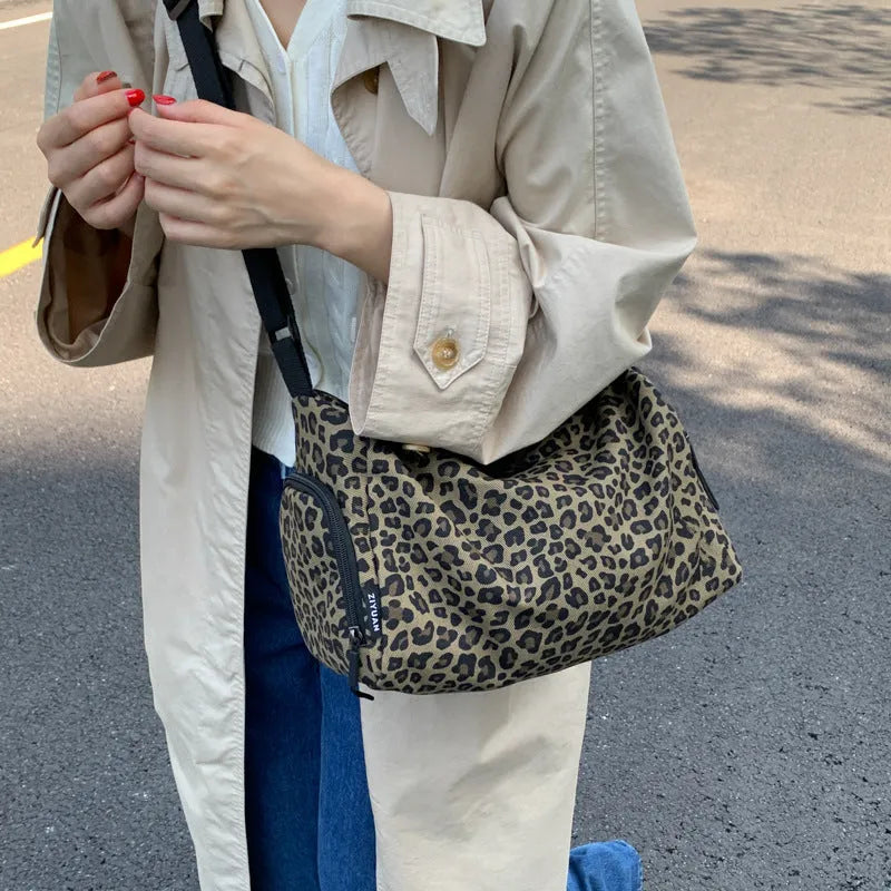 Leopard print sports style cross-body messenger bag with large capacity and shoulder strap