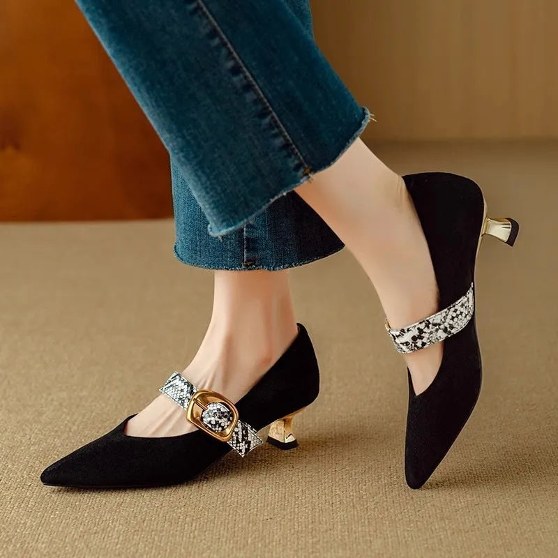 Women's black pointed-toe stiletto heels with a buckle fastening and mid-height heel.