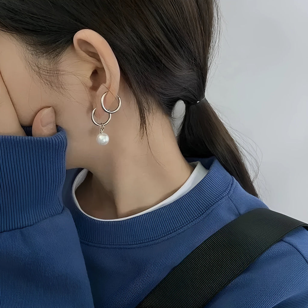 Women's geometric alloy earrings with a round pearl centre and titanium steel post.