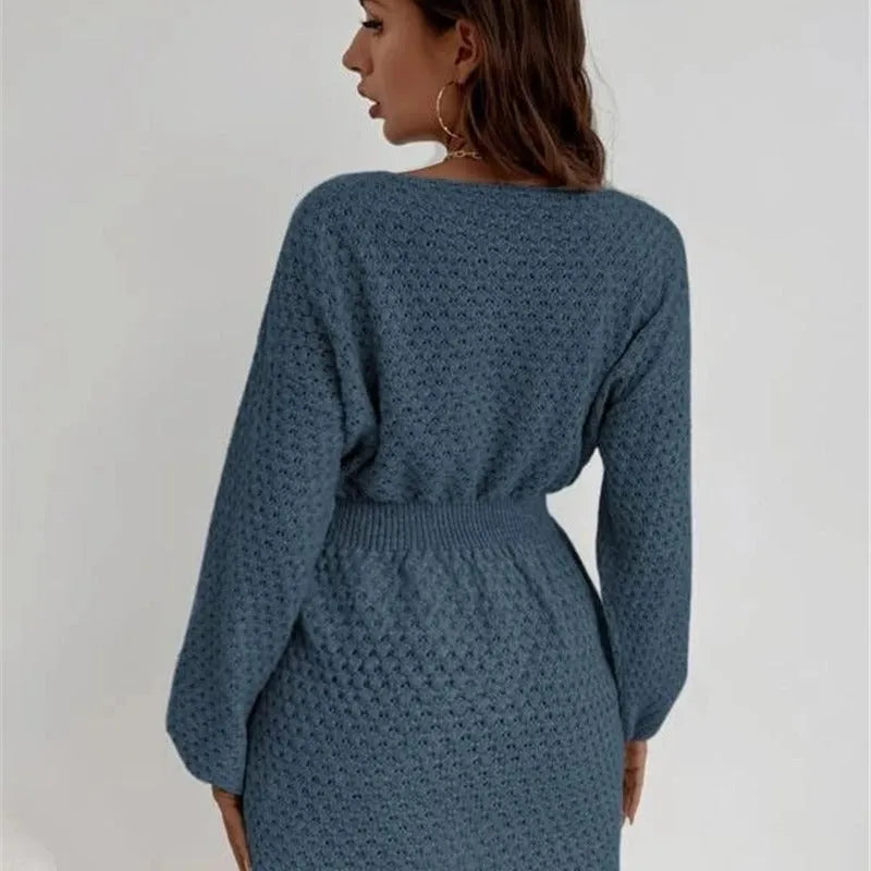 Blue slim-fit women's knitted dress with hand-crocheted flower detail on the front.