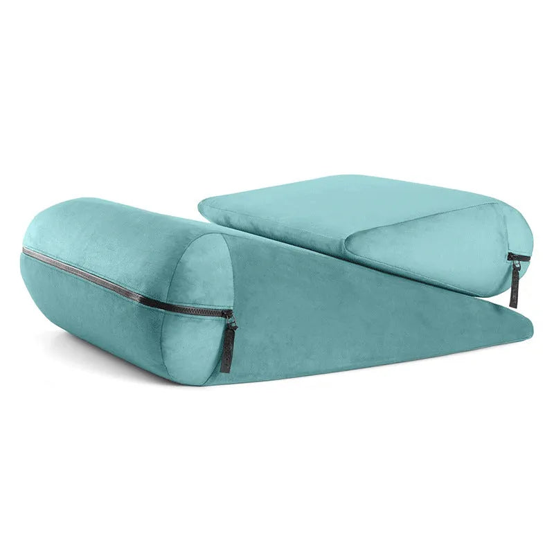 Embroidered triangle cushion in a choice of colours, shown on a sofa corner.
