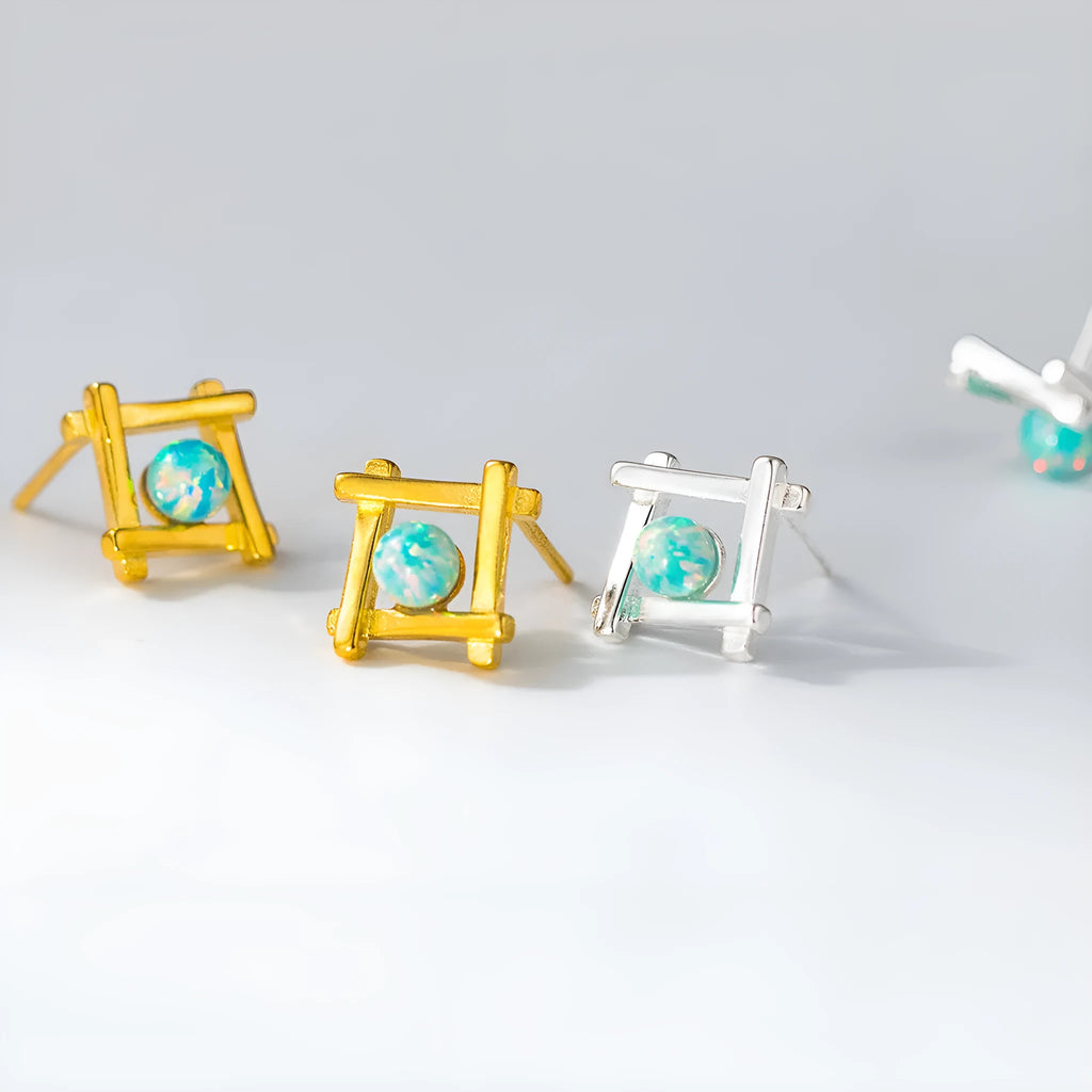 Women's geometric cross quadrangle stud earrings in sterling silver with gold or silver finish.