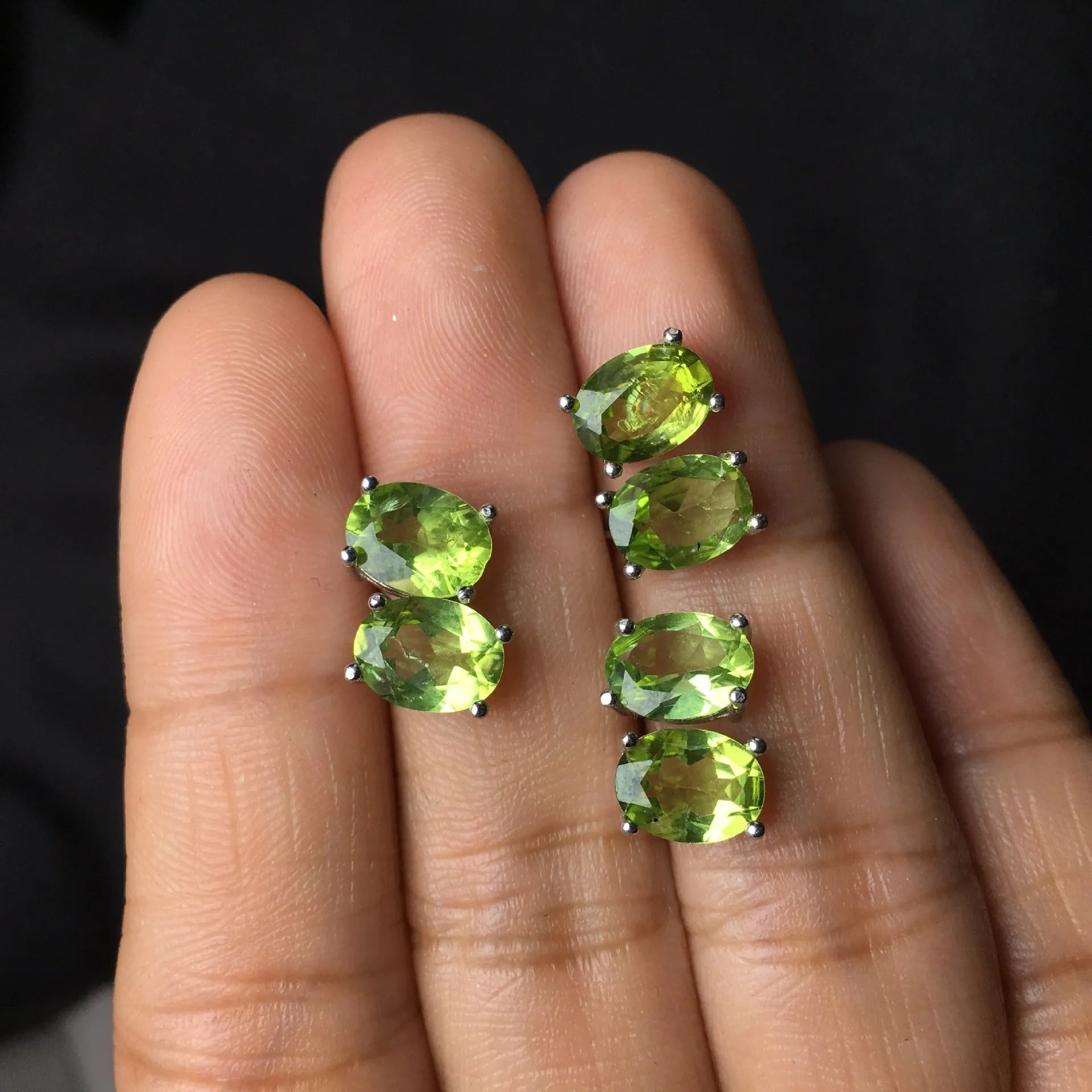 Natural olivine stud earrings with grass green oval stones in sterling silver setting