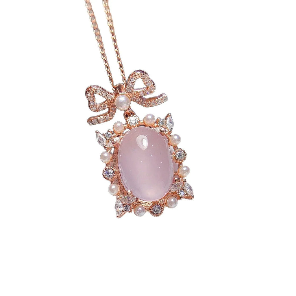 Rose gold plated geometric silver necklace with a pink rose quartz crystal pendant.