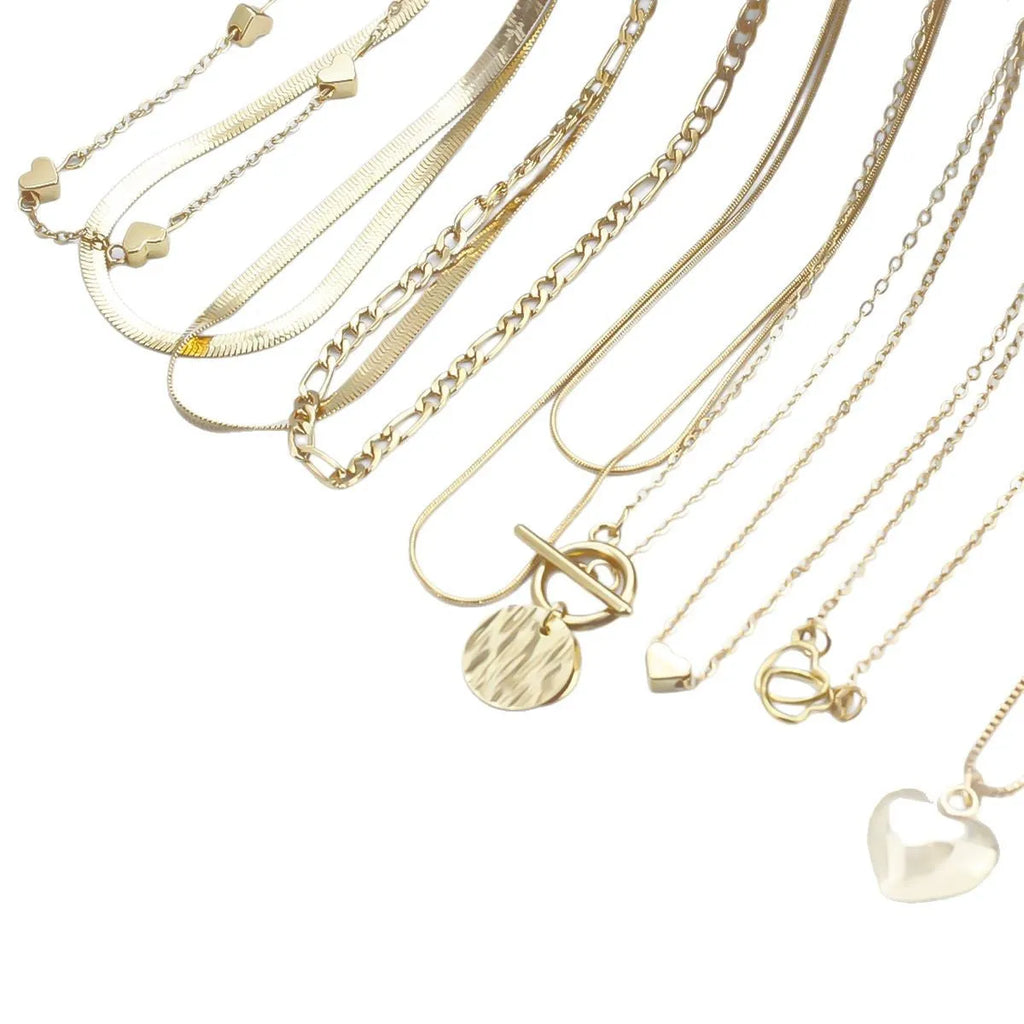 Gold-coloured women's necklace set showing ten pieces with simple alloy pendants on snake bone chains