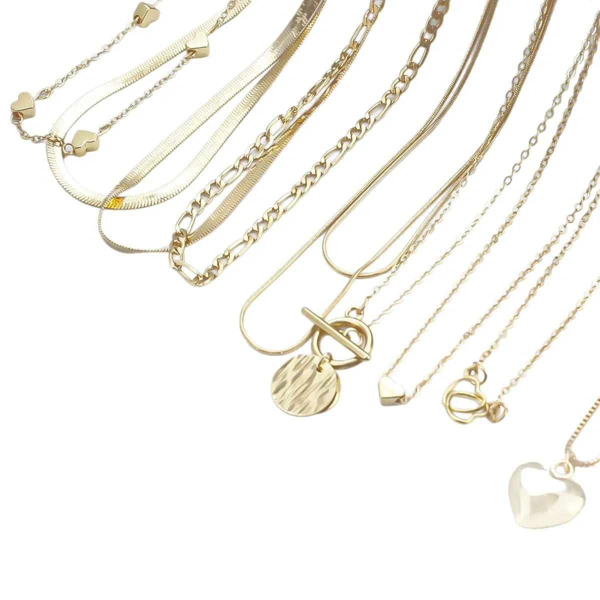 Gold-coloured women's necklace set showing ten pieces with simple alloy pendants on snake bone chains