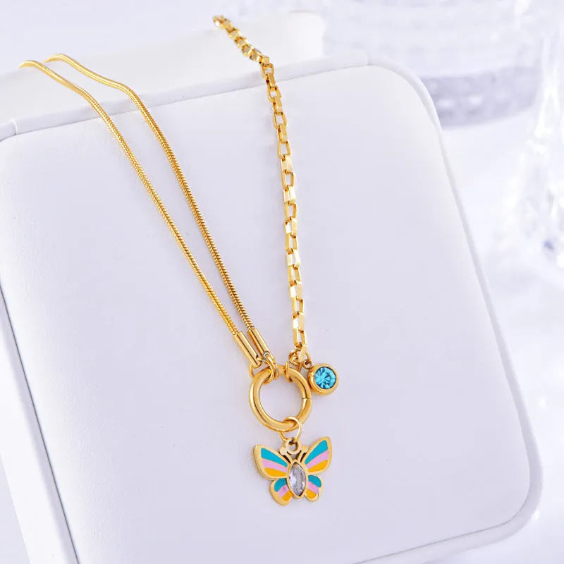 Gold tone epoxy butterfly necklace and bracelet set with snake bone chain.