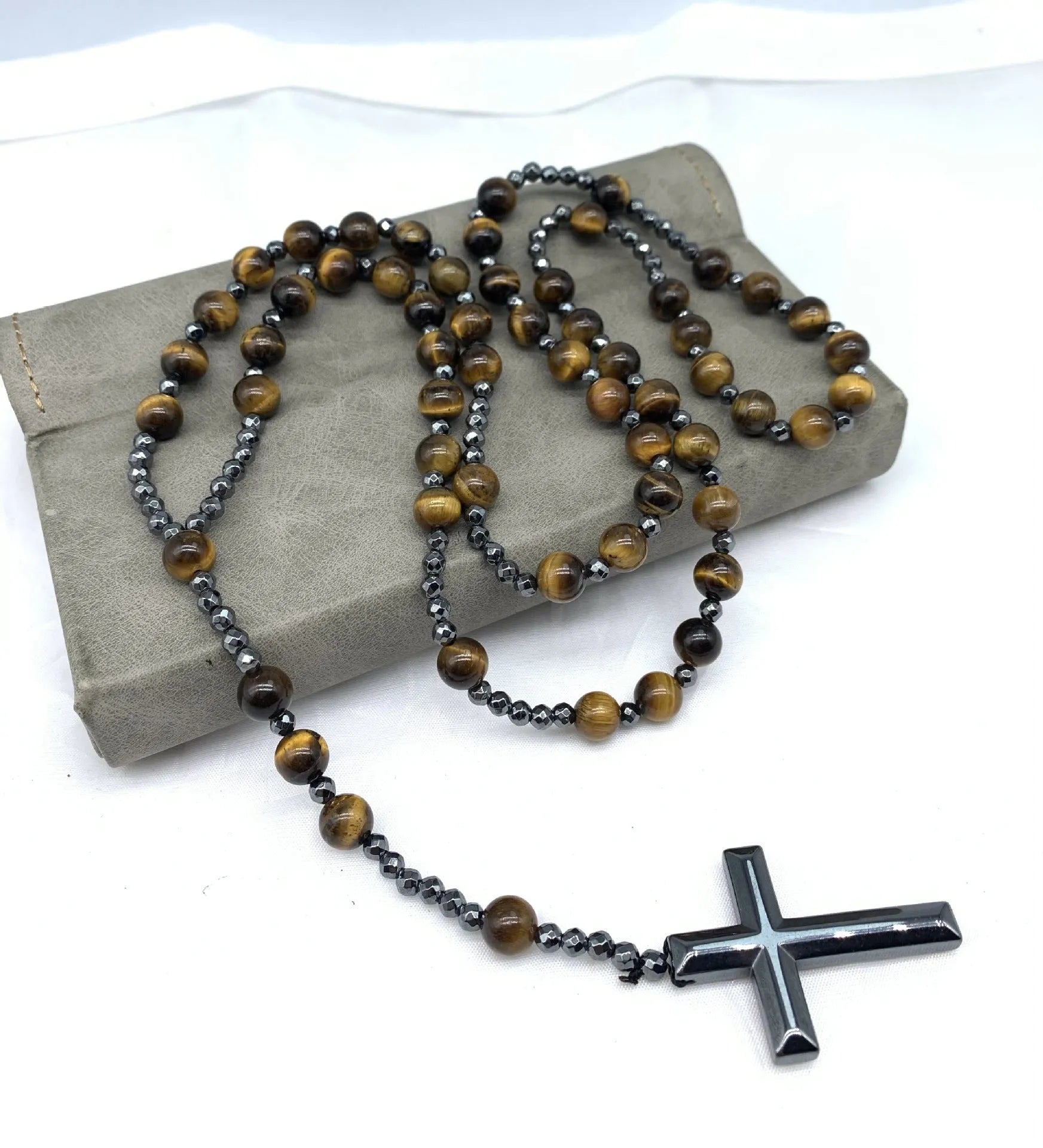 Men's stone cross pendant necklace with hand-woven detail on an 80cm ball bead chain.